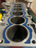 Inline-6 aluminum engine block filled with EPOXY54 around the cylinder bores
