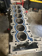 Open-deck inline-6 block after EPOXY54 fill, top view of cylinder deck